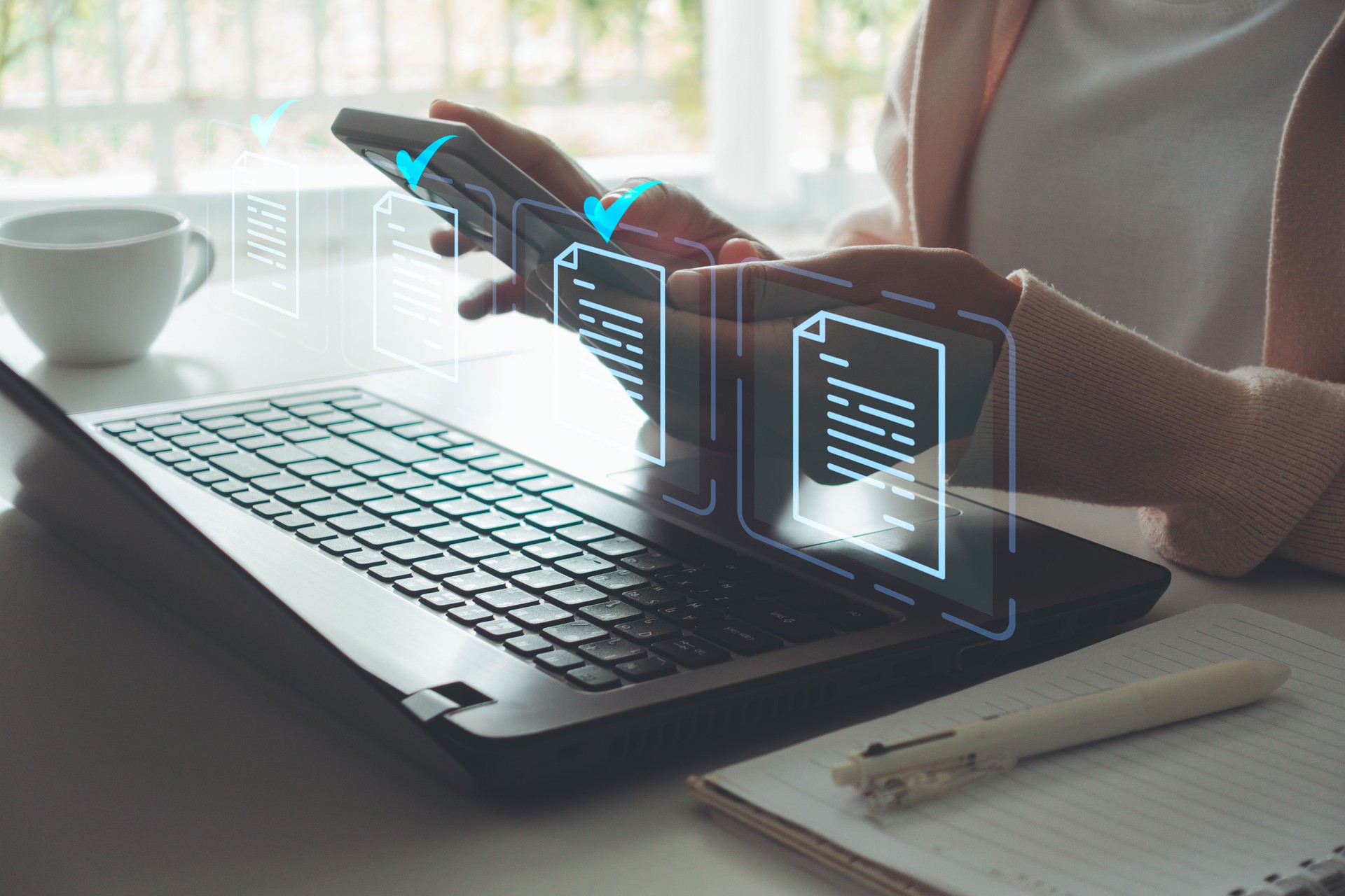 Women use smartphone and laptop computer for document online approval paperless quality assurance. ERP, E-document management system, online documentation database, paperless office concept